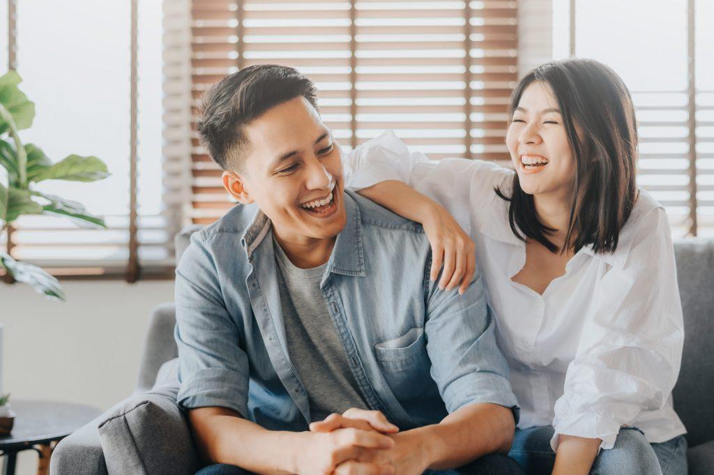 young asian couple laughing
