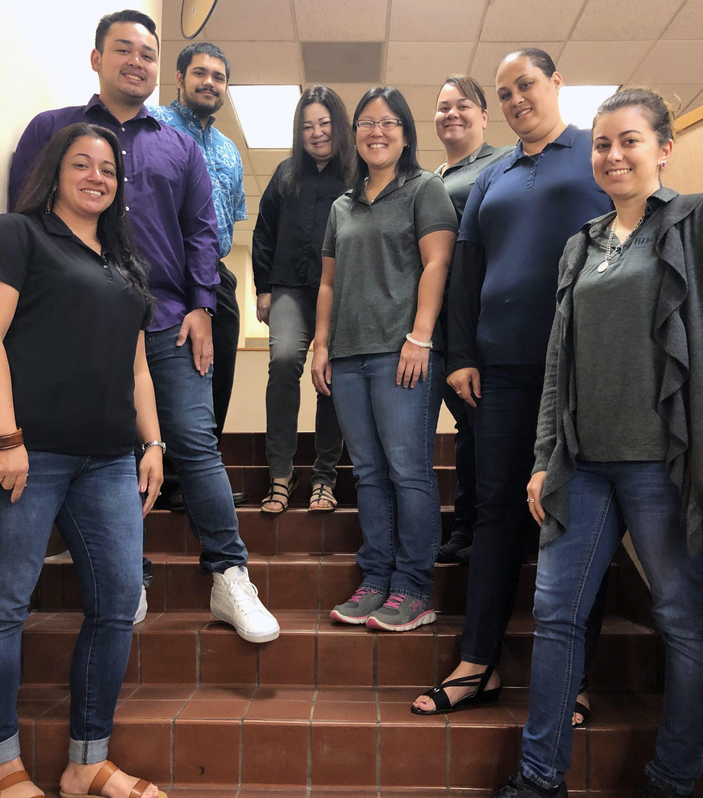staff from hfs pose for a group photo, they were all advisors of the high school junior achievement program