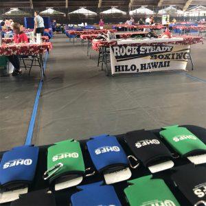 view of other vendor tables at the edith kanaka'ole tennis stadium for the Akamai Living Fair 