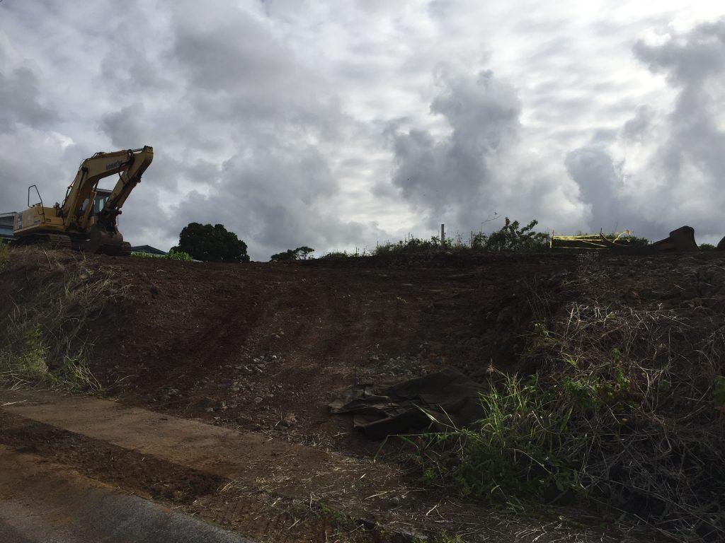 vacant plot of land being cleared to build a house