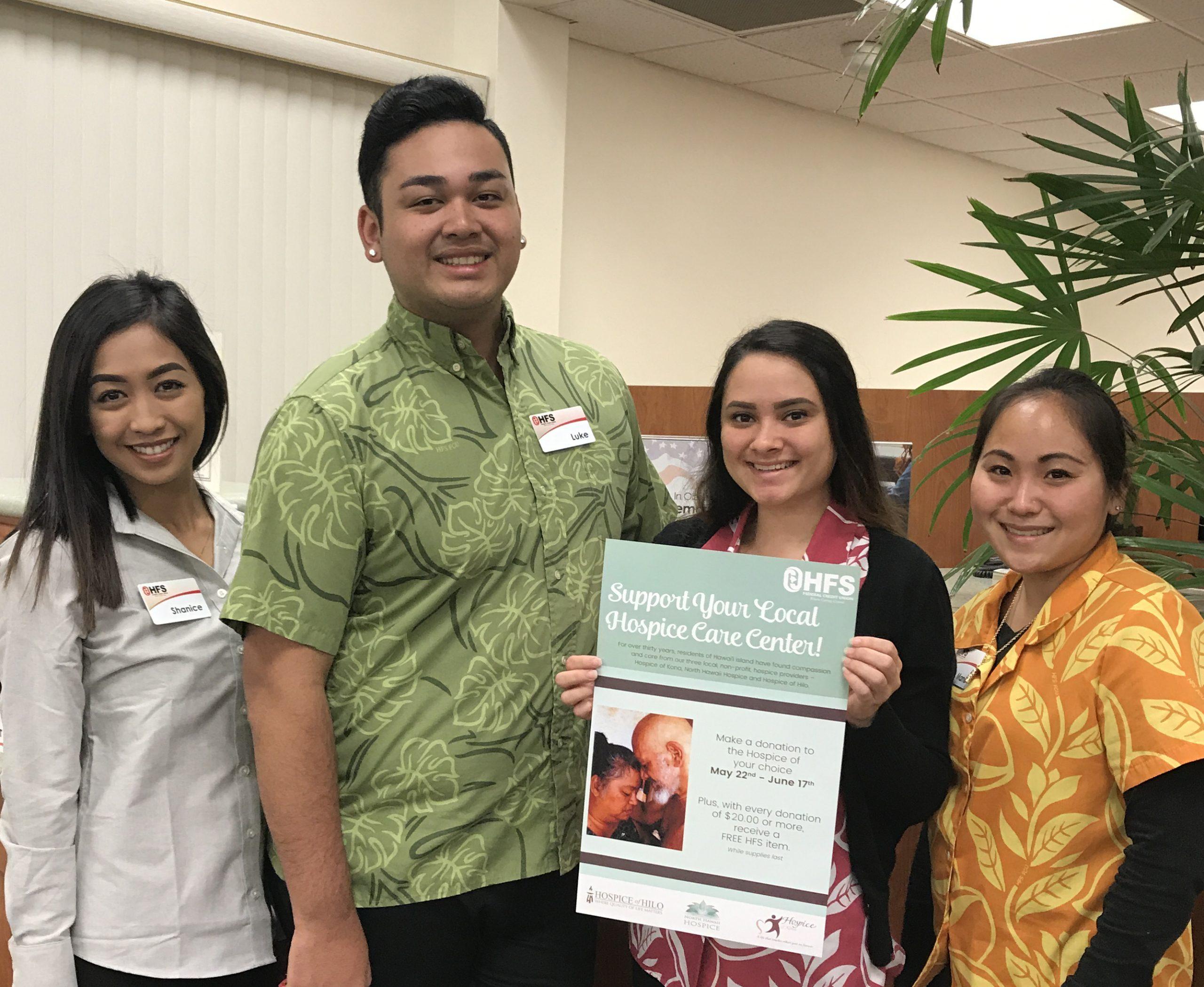 staff with fundraiser poster