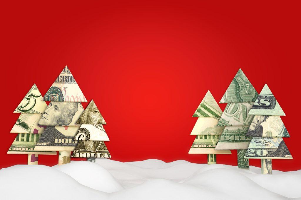 christmas trees made out of money against red background